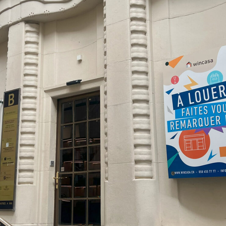 Affiche signalétique moderne sur plexiglass conçue pour Wincasa dans la Galerie St-François à Lausanne
